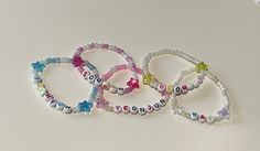 -Hand made beaded elastic bracelets. -Tomorrow x Together (txt) members different colour bracelets with matching stars. -Kai - white and clear -Soobin - purple and pearl with pink hearts -Yeonjun - pink and pearl -Beomgyu - yellow and pearl  -Taehyun - blue and pearl  -Approximately 8.5cm in diameter, all comfortably fit a 16cm measured wrist. *Default untracked shipping in Australia unless tracked selected* White Star-shaped Bracelet With Colorful Beads, White Kpop Beaded Bracelets With Letter Beads, White Letter Beads Bracelet Kpop Style, White Beaded Bracelets With Letter Beads Kpop Style, White Star Bracelets For Friendship, White Beaded Kpop Bracelets, Txt Members, Elastic Bracelets, Tomorrow X Together