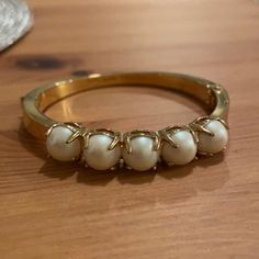 Gold-Tone Polished Band With Faux Pearl Inlay Bracelet. Secured Clasp. Hinge Opening. Bangle Style. Never Worn Excellent Condition, Very Minor Surface Tarnish From Time. Party Bracelets With Hinged Detail, Chic Gold Kate Spade Bracelets, Chic Kate Spade Gold Bracelets, Elegant Metal Bracelets By Kate Spade, Kate Spade Bangle Bracelet For Formal Occasions, Kate Spade Formal Bangle Bracelets, Elegant Kate Spade Metal Bracelets, Kate Spade Formal Bangle Bracelet, Kate Spade Bangle Bracelets For Party