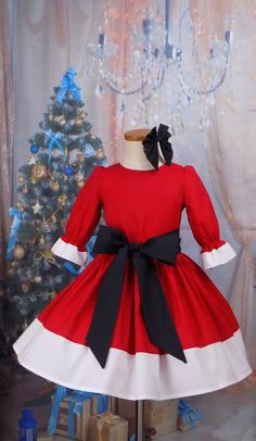 Red and White Santa Claus Looking Dress with Black Removable Sash and Hair Bow Perfect for Christmas day or a visit to Santa Can be used as a Christmas Pageant Outfit of Choice, OOC 3 Piece Set Includes: Button Back Dress with 3/4 Sleeves Removable Black Sash Black Clip on Hair Bow Fabric is 100 % Cotton Handmade Made in the USA by me! Pictures shown with a Tutu underneath for desired look Option for Premade Store Bought Tutu is available Picture 9 No Tutu, Sash or Bow All of my Unique items are Pageant Outfit Of Choice, Girls Santa Dress, Pageant Ooc, Girls Red Dress, Girls Western Dresses, Button Back Dress, Fancy Clothing, Serger Machine, Pageant Outfits