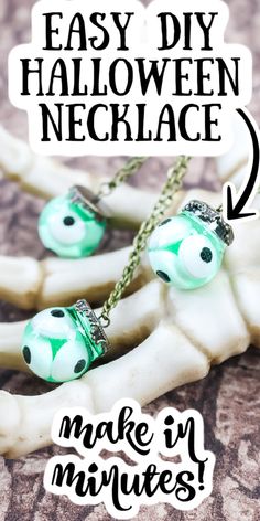 two skeleton necklaces with green and black beads hanging from it's sides, the words easy diy halloween necklace make in minutes