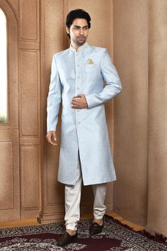 Blue sherwani with all over floral pattern and resham highlights. Paired with a off white churidar. - Aza Fashions Blue Unstitched Suit With Dabka For Reception, Blue Semi-stitched Sherwani For Diwali, Blue Semi-stitched Sherwani For Eid, Blue Semi-stitched Formal Traditional Wear, Formal Blue Semi-stitched Traditional Wear, Semi-stitched Blue Sherwani With Cutdana, Traditional Fit Sherwani With Cutdana For Eid, Blue Semi-stitched Traditional Drape Bandhgala, Blue Semi-stitched Bandhgala With Traditional Drape