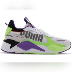 a white and purple sneaker with green accents