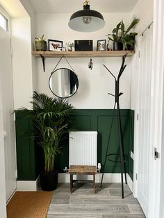 MDF small hallway panelling thought Bottle Green Hallway, Half Painted Wall Living Room Green, Dark Green Living Room Panelling, Green Lounge Panelling, Green Paint Hallway Ideas, Emerald Green Hallway Ideas, Wood Panneling Rooms Painted, Green Wainscoting Hallway, Dark Green Panelling Hallway