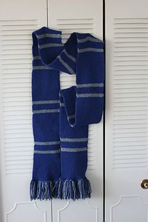 a blue scarf hanging on a white door