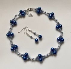 "Elegant blue  and silver beaded choker set  Pretty feminine design  Perfect for adding a touch of elegance to any outfit  8mm Deep blue glass pearls  4mm sunflower blue glass pearls 11/0 silver seed beads 15\" plus extension chain  Lobster clasp fastening  Matching earrings with silver plated hooks" Choker Necklace Set, Choker Set, Beaded Choker Necklace, Feminine Design, Seed Bead Earrings, Beaded Choker, Bead Earrings, Seed Bead, Matching Earrings