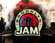 a man standing in front of a brooklyn jam logo on a building with other buildings behind him