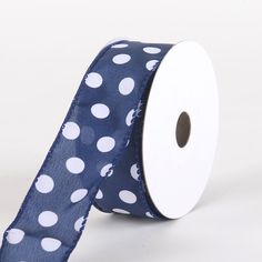 a roll of blue and white polka dot ribbon