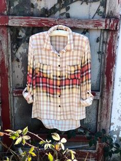 an old shirt hanging on a wooden door