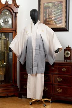 HAORI SIZE: Vertical Length: 96 cm (Collar Seam to Hem) Horizontal Length: 76 cm (Sleeve to Center Back Seam) Sleeve Depth: 54 cm (Sleeve Top to Bottom) Torso Width: 63 cm (Armpit to Armpit) KIMONO SIZE: Vertical Length: 144 cm (Collar Seam to Hem) Horizontal Length: 75 cm (Sleeve to Center Back Seam) Sleeve Depth: 53 cm (Sleeve Top to Bottom) Torso Width: 62 cm (Armpit to Armpit) FABRIC: Synthetic Fiber GAUGE: Medium TEXTURE: Soft-Crisp CONDITION: Excellent NOTE: Haori has 5 family crests. Kimono also has 5 family crests. BLEMISHES: None Observed Please note white Hanjuban undergown shown in gallery images is not included. Kimono Ensemble is a combo set with Kimono gown and Haori jacket. Due to the nature of being a vintage textile product, the item might come with partial wrinkles, fold Mens Robes, Men's Kimono, Kimono Gown, Haori Jacket, Male Kimono, Luxury Textiles, Chino Hills, Men's Robes, Family Crests