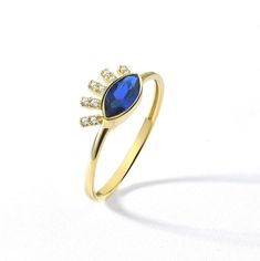 Blue  Sapphire stone Evil Eye women band ring in 14K gold, Minimalist ring with birthstone for custom gift, Ring for mama gift Unveil the protective charm of our Blue  Sapphire stone Evil Eye women band ring, a dainty gold ring that embodies the ancient symbol of safeguarding and enlightenment. Crafted with precision in 10k, 14k, and 18k solid gold, this exquisite piece features a captivating blue sapphire stone at its heart, surrounded by minimalist styling that speaks volumes. Perfect as a gif Sapphire Ring With Halo For Gift, 14k Gold Halo Birthstone Ring For Gift, Gold Minimalist Ring, Protective Charms, Blue Sapphire Stone, Dainty Gold Rings, Mama Gifts, Minimalist Ring, Gift Ring