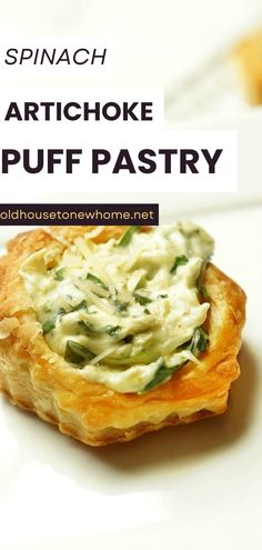 spinach artichoke puff pastry on a white plate with text overlay reading spinach artichoke puff pastry