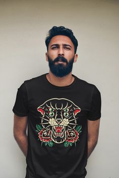 a man with a beard wearing a black t - shirt