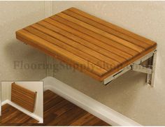 an image of a wooden bench on the floor with white frame and wood slats