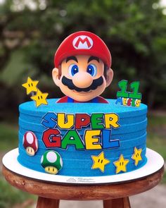 a birthday cake with mario on top