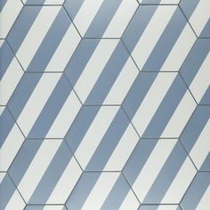 a white and blue tiled wall with lines on it