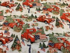 red trucks and christmas trees on snow covered ground with evergreens, stars and stripes