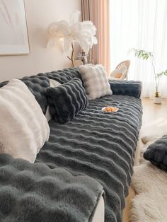 a couch with several pillows on top of it