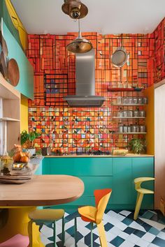 a kitchen with colorful tiles on the walls