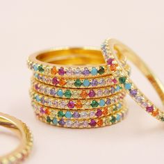 Our Rainbow Pave Band features dozens of colorful shiny crystals all the way around a sweet thin band. It's the perfect punch of color your ring collection needs. Super durable and dainty - the best of both worlds! Available in solid sterling silver or a thick 14kt gold plated over sterling silver DETAILS - 14kt gold plated or sterling silver - Rainbow crystal pave - Sizes 5-13 available Packaging + Delivery: All items come packaged in a cute Amanda Deer Jewelry box and are sent in a protective bubble mailer. If ordering multiple pieces, please let us know if you'd like separate boxes for each one. If not, we'll include them in one box for you. See all of our listings here: http://www.amandadeer.etsy.com XOXO The Amanda Deer Team Photos and copy are copyright Amanda Deer Jewelry Visit Our Shiny Crystals, Deer Jewelry, Rainbow Ring, Rainbow Rings, Rainbow Jewelry, Pave Band, Gold Statement Earrings, Skull Bracelet, Ring Collection