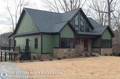 a large green house sitting in the middle of a forest