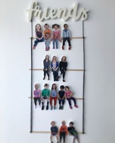 a group of people hanging from the side of a wall with words friends on it