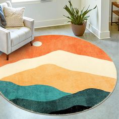 a living room with an orange, blue and green rug on the floor next to a chair