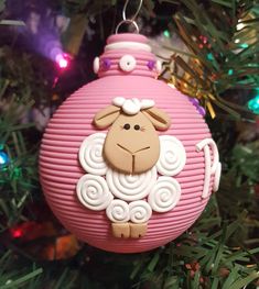 a pink ornament with a sheep on it