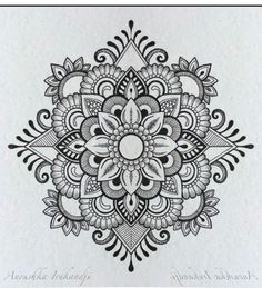 a black and white drawing of a flower with intricate designs on the bottom half of it