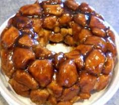 a bundt cake covered in caramel sauce on a white plate