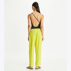 Crafted from lightweight linen, our beach pant is effortless and ultra-comfortable, featuring a drawstring waist and front patch pockets for added convenience. Ankle cuffs elevate the relaxed style. Beachwear Bottoms For Beach Season Travel, Beachwear Bottoms For Travel And Beach Season, Beachwear Bottoms For Travel During Beach Season, Wide Leg Pants For Poolside, Summer Pants For Resort Season, Casual Spring Pants For Poolside, Casual Pants For Poolside In Spring, Casual Summer Travel Pants, Chic Poolside Bottoms For Resort Season