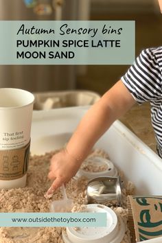 a young boy is playing with his pumpkin spice latte moon sand at the same time