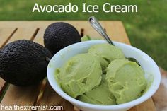 avocado ice cream in a white bowl on a wooden table