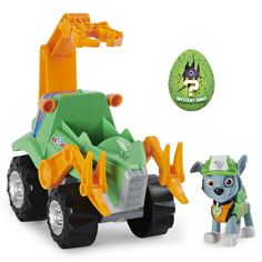 a toy truck with a dog next to it and an advertisement for paw patrol on the side