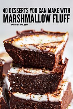 chocolate brownies stacked on top of each other with marshmallow fluff in the middle