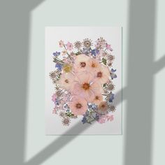 an arrangement of flowers on a white background