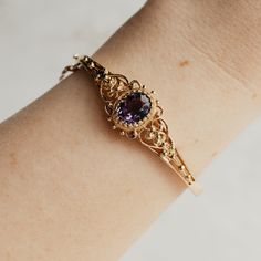 This is a perfect piece of fine jewelry history. A 14K yellow gold filigree bracelet with an oval 3.93ct amethyst secured by a stunning multi-prong setting. This bracelet has a fully functional hinge clasp and safety chain. The bracelet is in beautiful shape. Luxury Oval Amethyst Jewelry, Formal Filigree Bangle Jewelry, Heirloom Oval Bracelets For Formal Occasions, Heirloom Amethyst Jewelry For Formal Occasions, Elegant Amethyst Jewelry, Ornate 14k Gold Gemstone Jewelry, Classic Oval Amethyst Jewelry, Classic Amethyst Oval Jewelry, Ornate Hallmarked Oval Bracelets