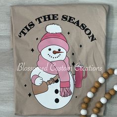 Tis the Season Snowman available in T-shirt or a Crewneck Sweater  Product Description Made to order Unisex Adult tee This Design will be made with screen printing  Unisex t shirt fits like a well-loved favorite, featuring a crew neck, short sleeves ❤GARMENT FEATURES ❤ * Uniquely soft and comfortable ringspun/pre-shrunk Bella & Canvas shirt * Solid colors: 100% Preshrunk Cotton, Heather Colors: 52% Cotton / 48% Poly(except Athletic Heather with %90 cotton %10 polyester) * Uniquely soft and comfo Winter Crew Neck Pre-shrunk T-shirt, Snowman Tshirts, Sweater Tshirt, Pink Cups, Gildan Sweatshirts, Shirt Fits, Crewneck Sweater, Tis The Season, Crew Neck Sweater