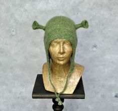 Winter hat, Knit hat, Alpaca beanie hat, Ogre hat gift for men, Shrek costume hat, Christmas gift for women More animal hats you can find here: https://etsy.me/3B4ySGh This lovely Shrek inspire hat might be the perfect gift for your friends. This bonnet hat with ears is hand-knitted. It's made of very soft yarn -blow yarn, made of baby alpaca wool with the addition of polyamide. Adding polyamide to the yarns makes them more durable, and the knitted fabrics hold their shape better. The hat is soft and warm. It will protect you before the winter chill. One size. Color: green. Because of different monitors and screen resolutions, color may look different on the screen than in reality. If you want such a hat in any other color please feel free to contact me. I will be happy to make it for you. Alpaca Beanie, Shrek Costume, Hat With Ears, Hat Knit, Bonnet Hat, Animal Hats, Knitted Animals, Quality Hats, Ear Hats