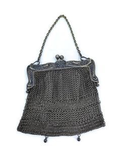 "A wonderful antique German silver purse, the Victorian metal mesh bag has a kiss closure on the hinged floral frame. Marked A B.M.CO Ger. Silver on the frame, the purse is a beautiful example of coin purses from the era The purse is in very good vintage condition. Overall a lovely antique bag and a great addition to your collection. The purse measures approximately 5 1/2\" tall by 5 1/2\" wide." Evening Purse, Vintage Purses, Beaded Purses, Chatelaine, German Silver, Mesh Bag, Purse Pouch, Vintage Handbags, Chain Bags