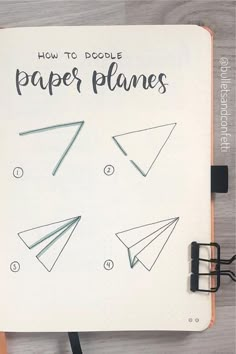 an open notebook with paper planes on it and the title how to doodle paper planes