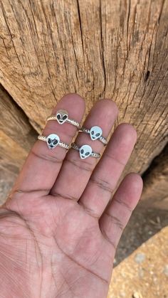 These .925 Sterling Silver Alien Head Rings come in two styles: High Shine or Old Style. With a twist band shank and detailed alien head, they're a must-have for any fan. Spaced out with a fun twist, these rings are out of this world! Adjustable Silver Skull Ring Collectible, Adjustable Silver Novelty Ring, Silver Adjustable Symbolic Skull Ring, Novelty Silver Ring Jewelry, Themed Silver Ring Jewelry, Adjustable Silver Skull Ring Spiritual Style, Adjustable Silver Skull Ring In Spiritual Style, Adjustable Themed Silver Rings, Silver Adjustable Spiritual Skull Ring