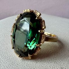 Beautiful Vintage Ring In Solid 14k Yellow Gold (Unmarked, But Tested) . The Gorgeous Deep Bottle Green Shade Synthetic Stone Is Approximately 16mm X 12mm In Size. The Ring Is A Size 6.5 On Ring Mandrel, Weights 6.7 Grams. Very Well And Solid Made, Very Unusual , Looks Like A Very Well Made Ring With A Chunky Band / Setting. The Stamp Was Possibly Lost To Previous Resizing , I Do See A Very Faint Line In The Back Of The Band, However, Resizing Have Been Done , It Was A Very Seamless Job To The Naked Eye). The Ring Is Simply Superb , Unusual Color, Great For The Holidays Or Anytime , Anywhere! Large Emerald Ring, Ring Mandrel, Beautiful Rings Vintage, Spinel Ring, Bottle Green, Vintage Ring, Emerald Ring, Womens Jewelry Rings, Cocktail Rings