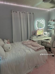 a bedroom decorated in white and pink with hello kitty decorations