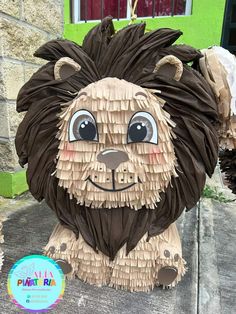 a close up of a paper mache of a lion