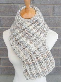 "This beautiful hand knitted scarf is made with Super Bulky and Soft Wool Blend Yarn (80% Acrylic, 20% Lambswool). Classic ribbed pattern, it looks the same on both sides. The scarf can be worn in multiple ways. Very beautiful colors: shades of off white, grey, and brown. The colors may appear slightly different on different monitors. Measures: 65\"- 67\" (165-170 cm) long x 7\" (18 cm) wide. From a smoke-free home. Care instructions: Hand wash in cool water and dry flat." One Size White Crochet Knitting Pattern, White Knitted Scarf For Fall, Hand Knitted Yarn Scarves, White Yarn Knitting Pattern, White Crochet Scarf One Size, Hand Knitted White Yarn Knitting Pattern, White Yarn Crochet Knitting Pattern, Cozy Knitted White Scarves, Winter White Crochet Knitting Pattern