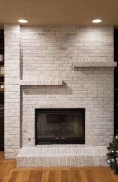 a white brick fireplace in a living room