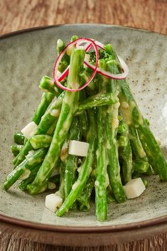 asparagus with onions and radishes on a plate