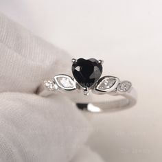 It is a graceful heart shaped black spinel ring with CZ decorated as leave. ❉Ring Features Center Stone: Black Spinel Center Stone Cut: Heart Cut 6*6mm Side Stone: CZ Metal type: 925 Solid Sliver/14K White Gold/14K Rose Gold ❉Production time: All jewelry are handmade by me. Please allow 8~10 working days to make your piece after placed the order. ❉Made to Order Add engraving free of charge Different metal, gemstones or shapes available Personalization requests available Every piece of jewelry co Leave Ring, Vintage Cluster Ring, Black Spinel Ring, Spinel Ring, Ring Heart, Gift Pack, Message Box, Black Spinel, Stone Cuts