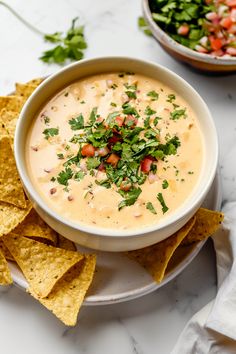 a bowl of quesadilla dip with tortilla chips on the side