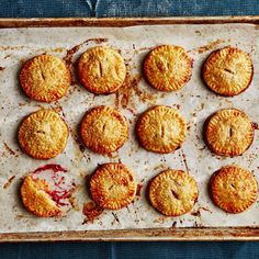 twelve baked pastries on a baking sheet